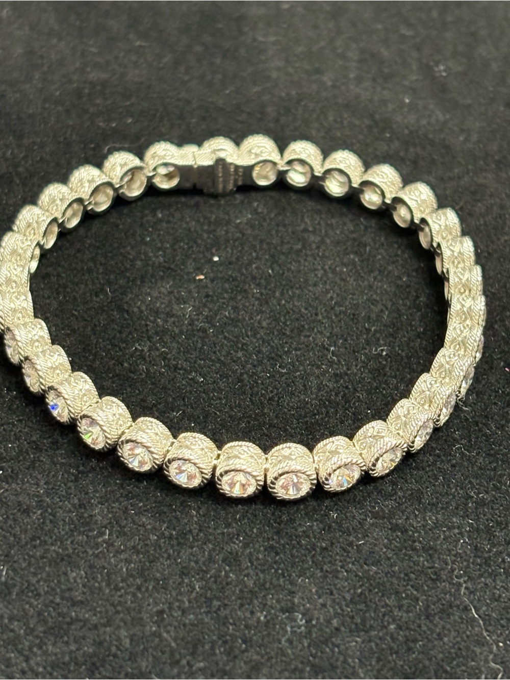 Judith Ripka 925 silver and CZ round bezel set tennis bracelet. 7.5 inches